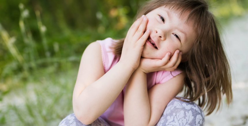 portrait-of-young-girl-with-down-syndrome-2021-08-26-17-33-25-utc-min